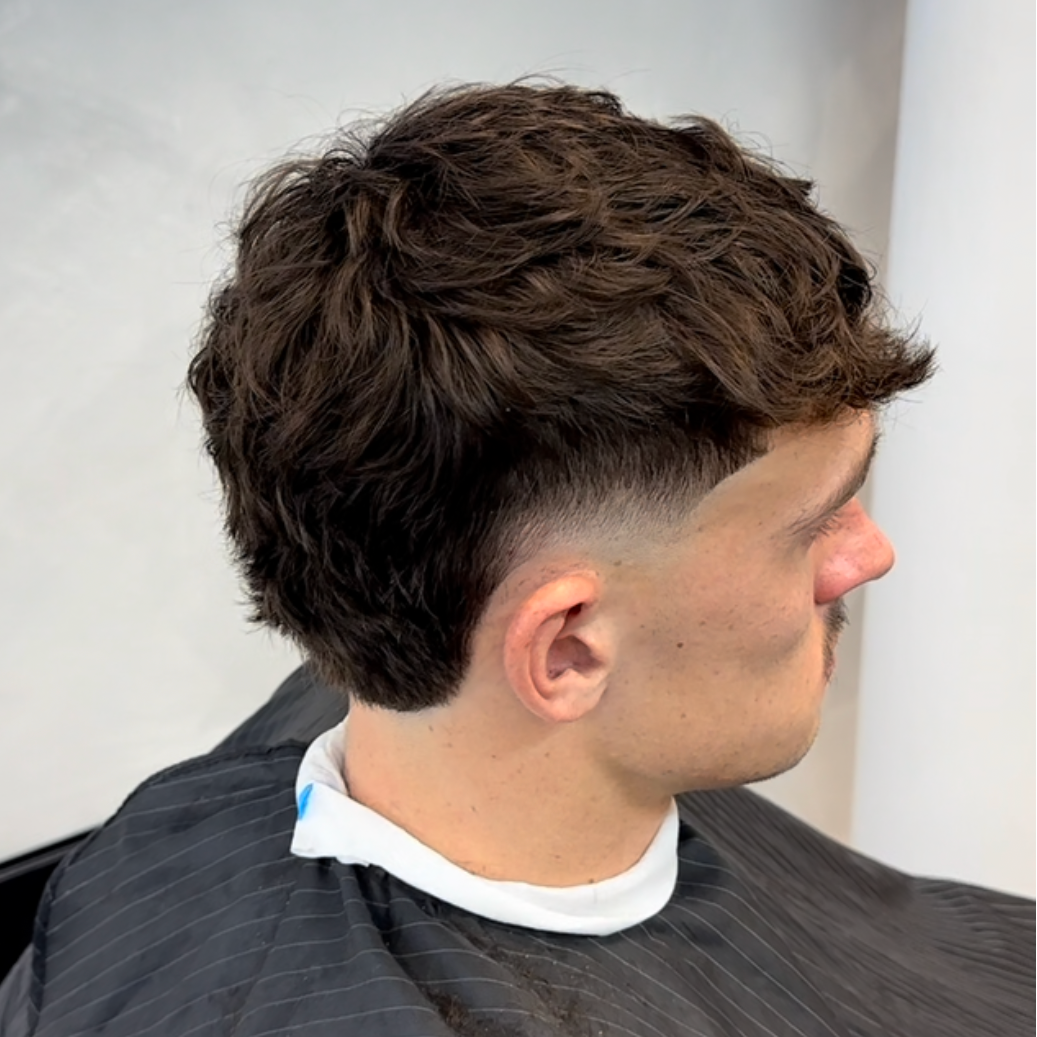 Man with styled hair in a salon setting